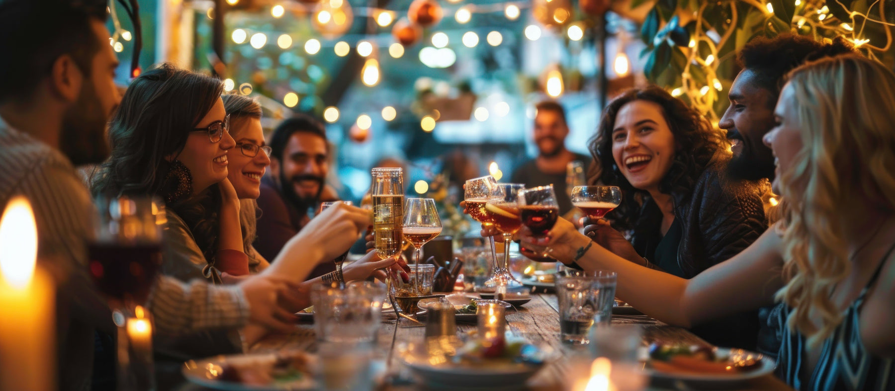 People raising glasses around a table in a bar