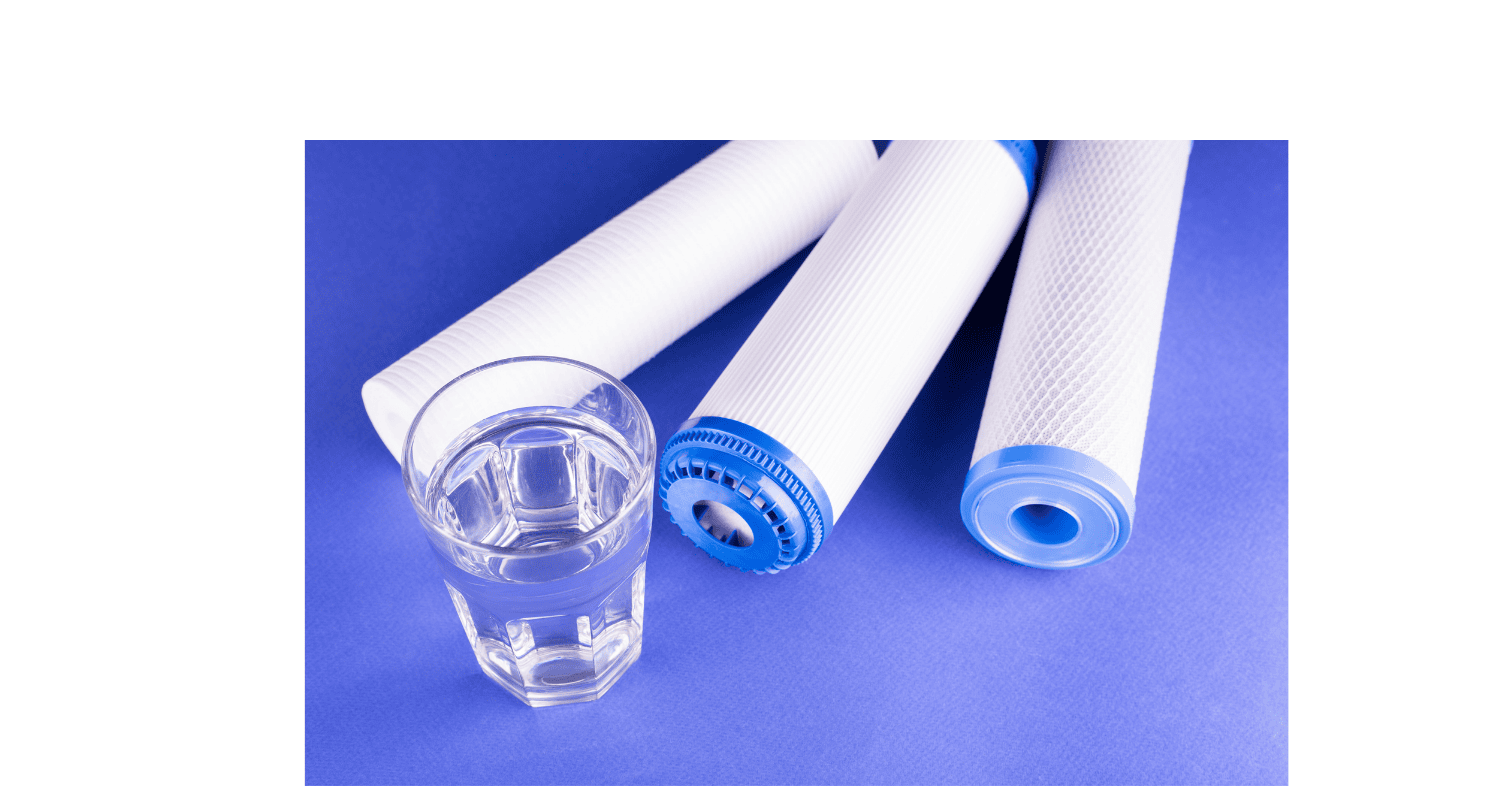 Three water filters and a glass of water