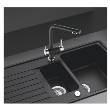 clearwater filter tap in black installed over a sink
