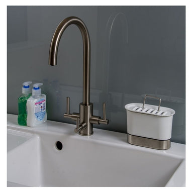 clearwater stella filter tap in a kitchen sink with two bottles of washing up liquid