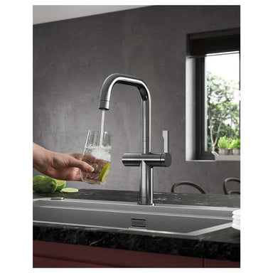 Clearwater Brushed Nickel kitchen tap pouring water into a glass