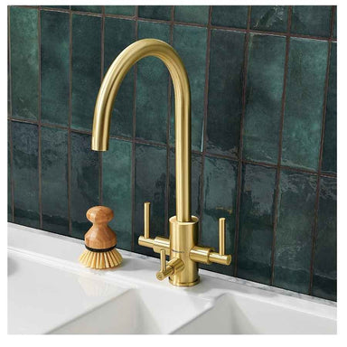 clearwater stella filter tap installed in a kitchen with a brush next to it
