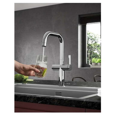 Clearwater Mariner tap pouring water into a glass in a kitchen