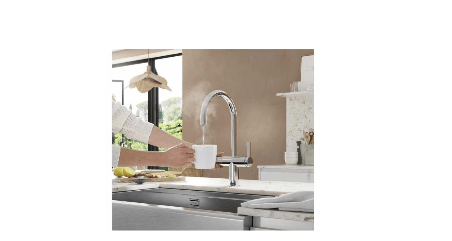 a chrome tap produces boiling water into a cup