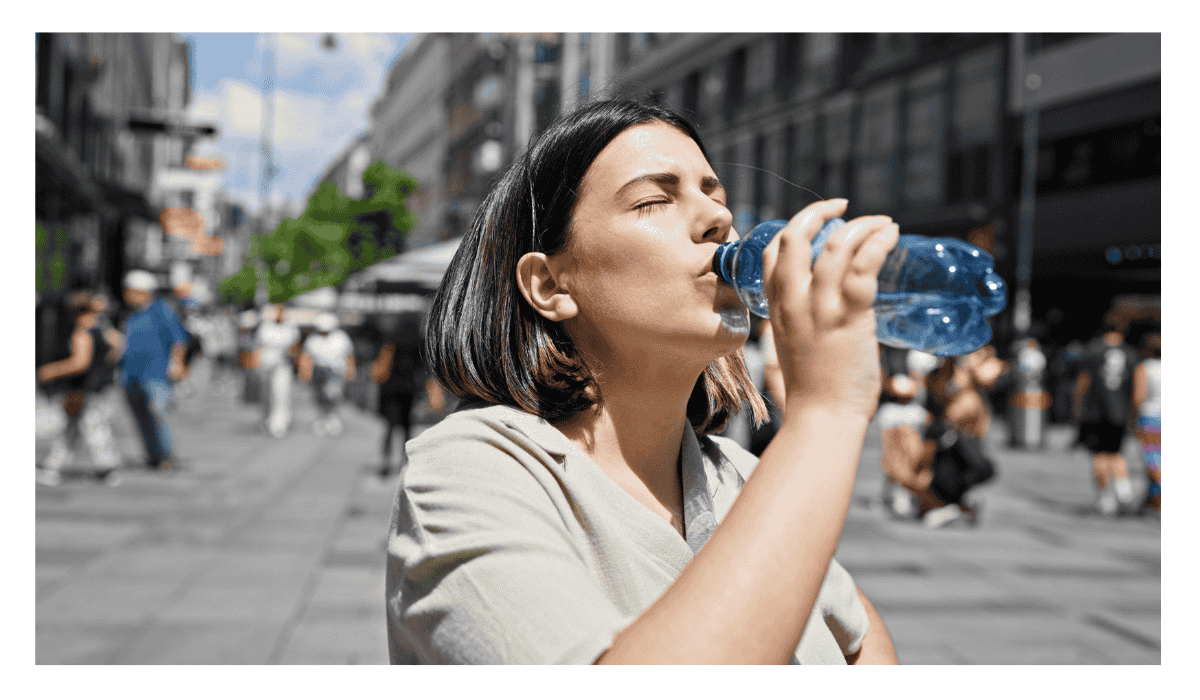 A woman drinking bottled water