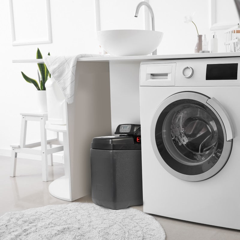 A Water Softener next to a Washing Machine
