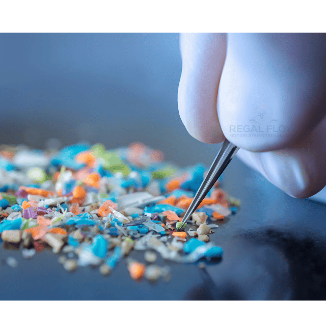 Microplastics being picked up by a hnad with tweezers 