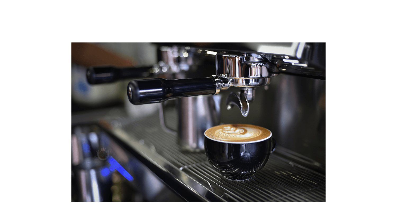A coffee cup under a coffee machine