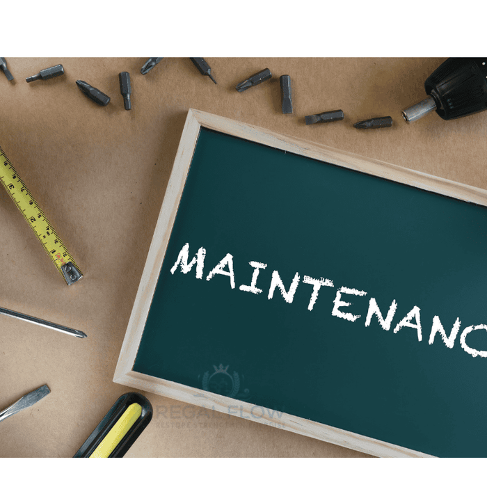 A maintenance sign with tools around and a regal flow logo