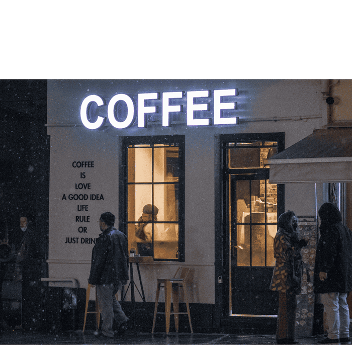 a coffee shop with people out side and regal flow logo