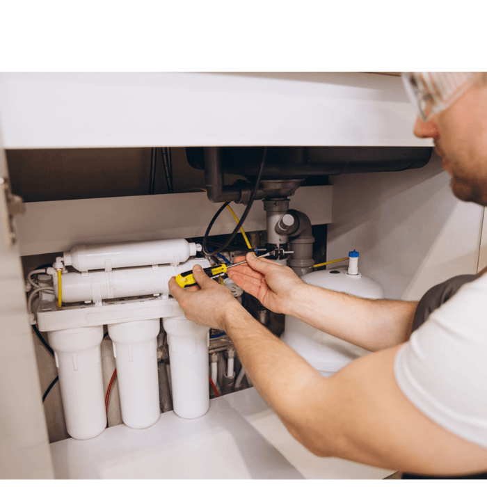 Under sink reverse osmosis system and plumber