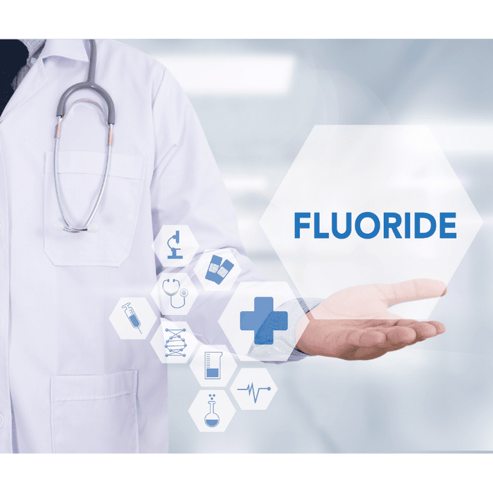 A fluoride symbol in a hand