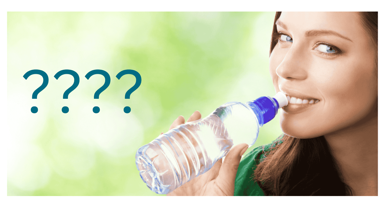 A woman drinking water from a bottle