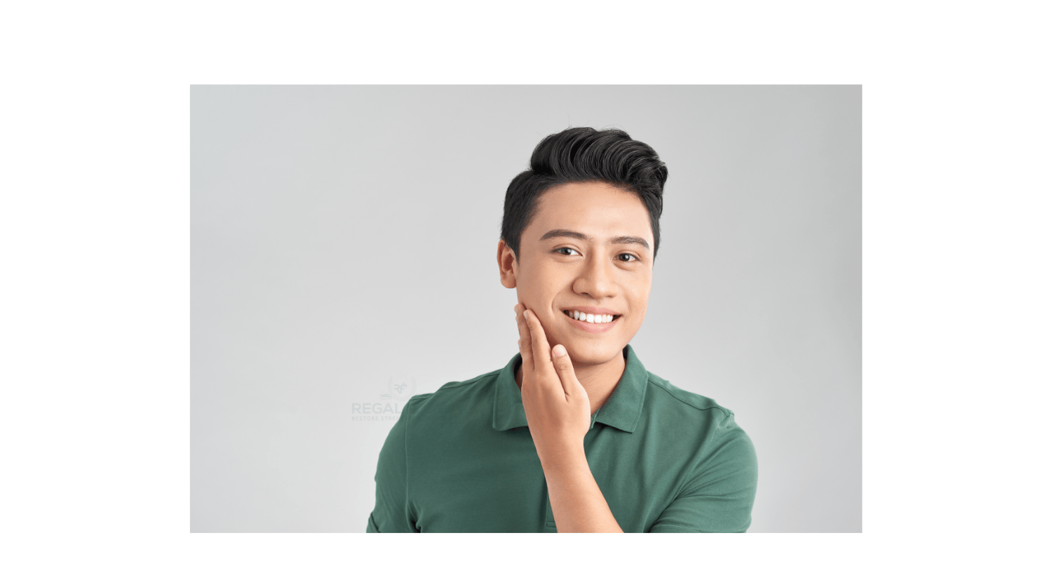 a man with his hand to his right cheek