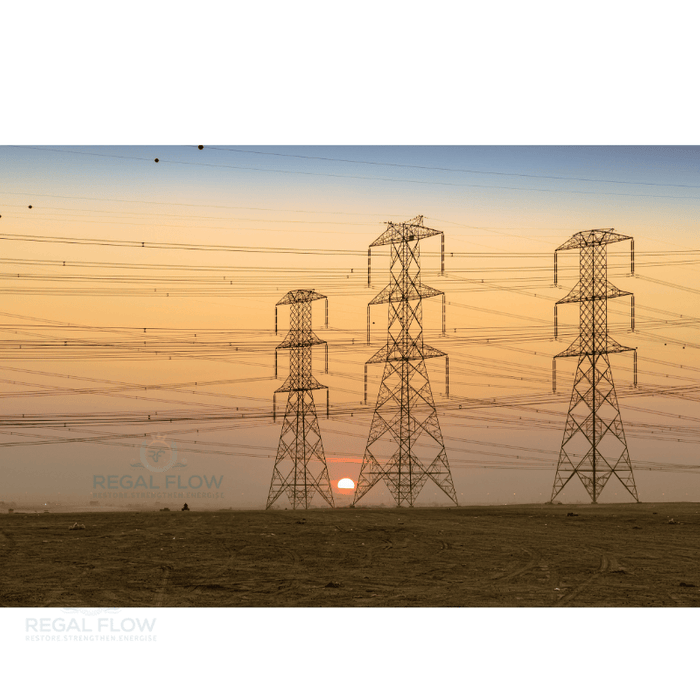 three pylons in front of a sunset