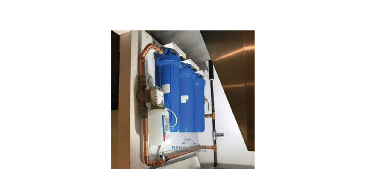 A whole house water filter installed with pipes