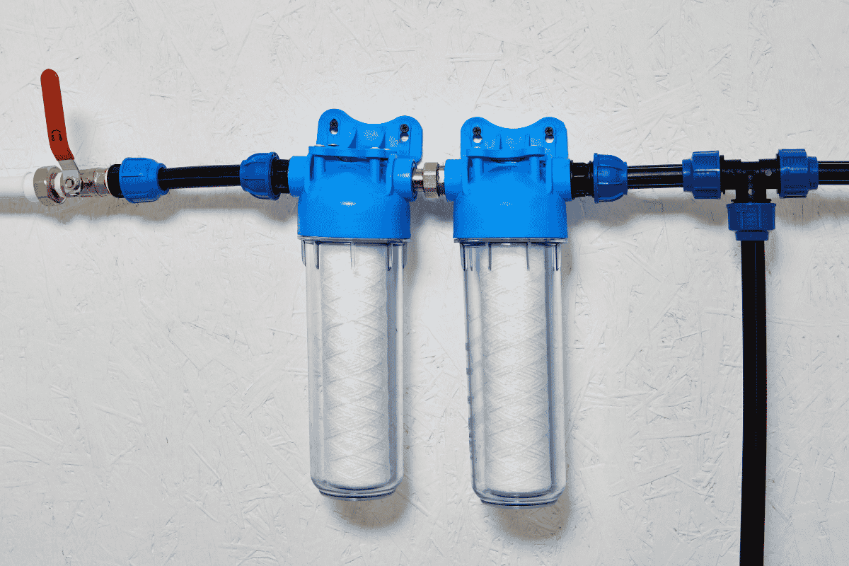 a whole house water filter system installed on a wall