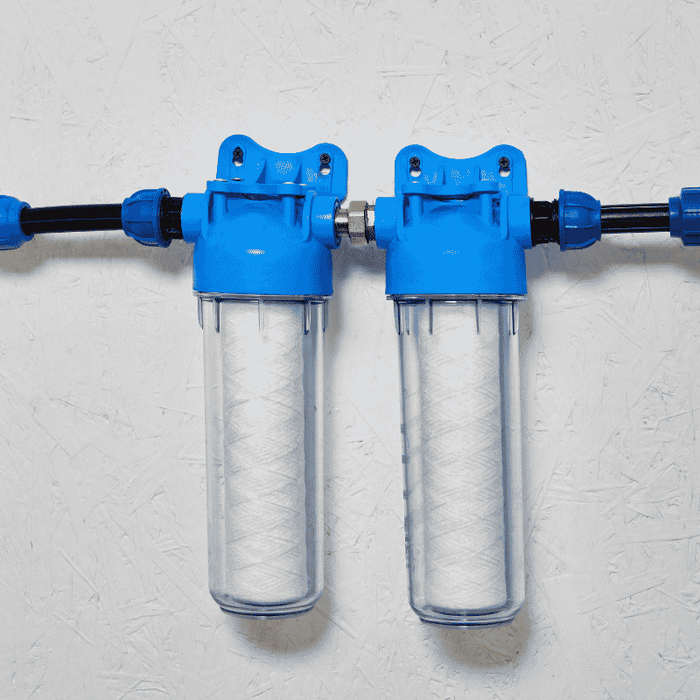 a whole house water filter system installed on a wall