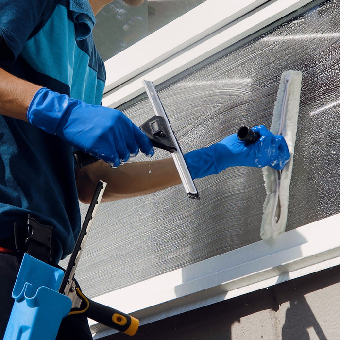 A window cleaner cleaning windows