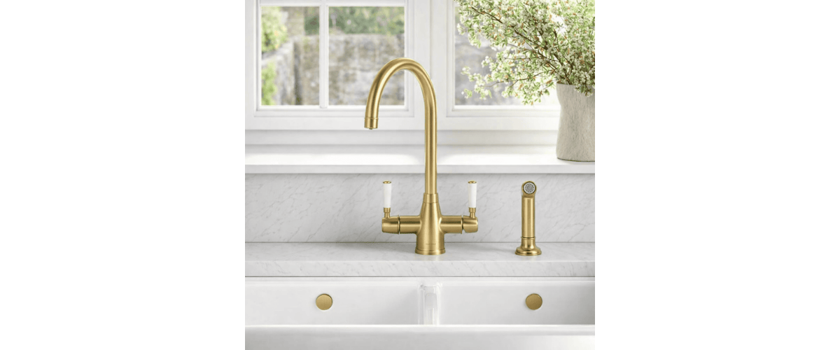 Brushed Brass kettle tap with spray installed above a sink in a modern kitchen