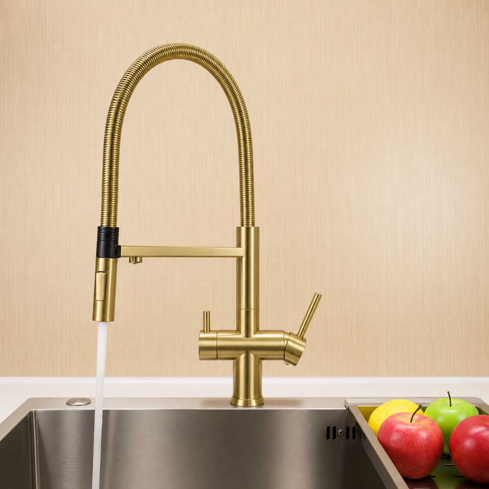 brushed brass hommix kitchen tap above a sink with apples on a tray