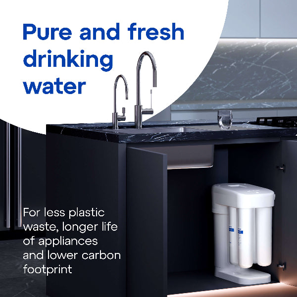 Aquaphor RO-101S filtration unit on blue background with chrome tap