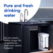 Aquaphor RO-101S filtration unit on blue background with chrome tap