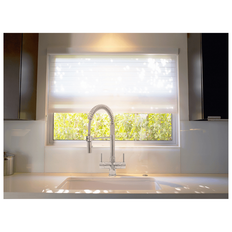Milano 3 chrome pull-down 3-way tap installed in bright kitchen setting