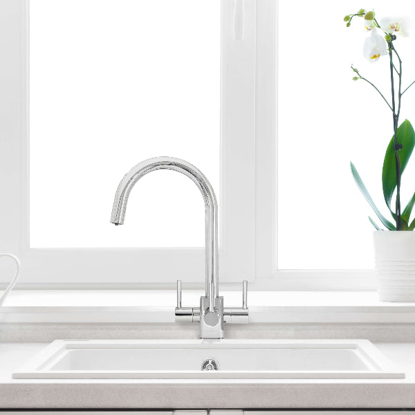 Verona SQ chrome 3-way tap installed on white sink beneath window for filtered water use