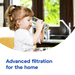 Child drinking purified water from Aquaphor reverse osmosis filter
