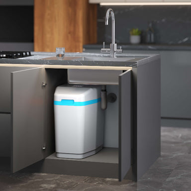 Aquaphor S550 water softener installed under kitchen sink beside tap