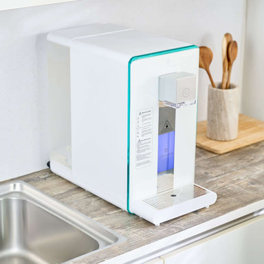 Ayus Wellness hydrogen-ion water purifier on kitchen countertop