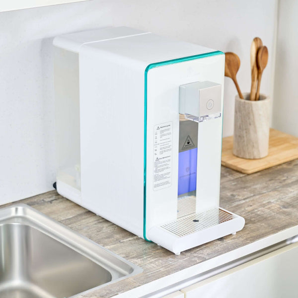 Ayus Wellness hydrogen-ion water purifier on kitchen countertop
