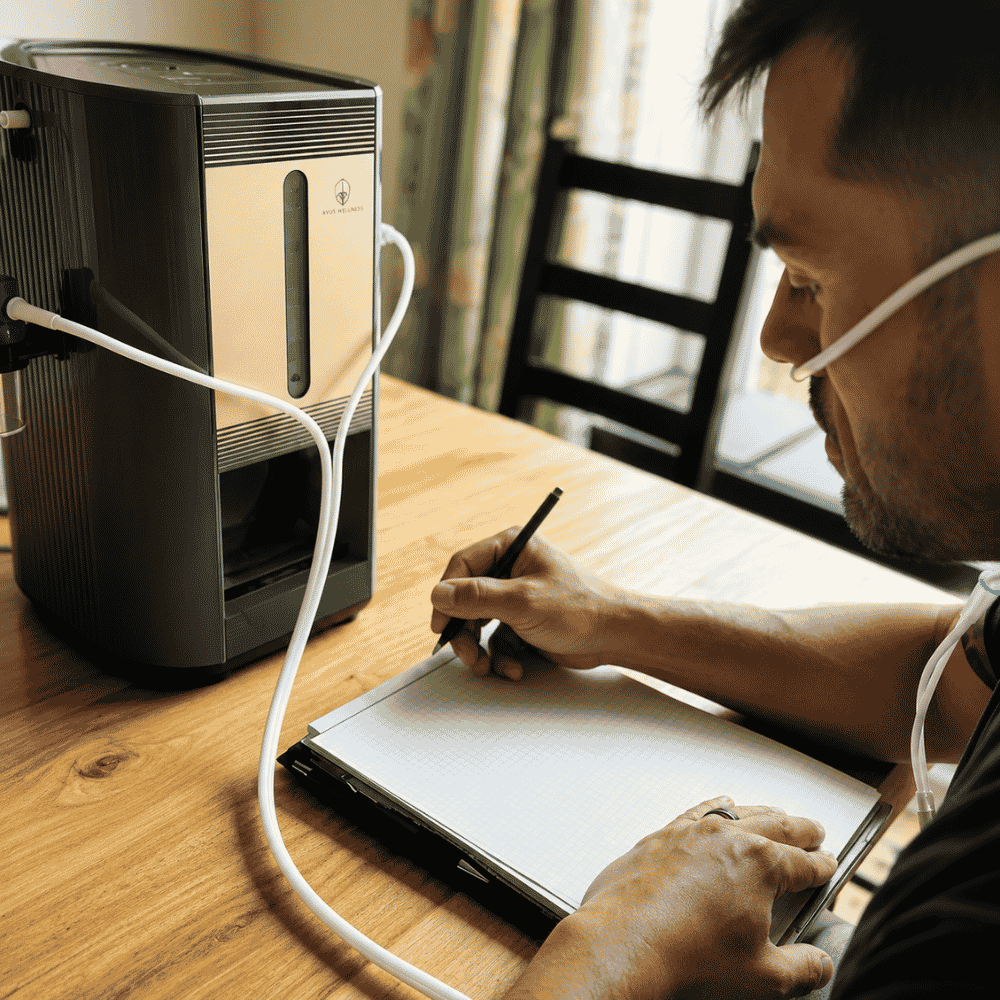 A hydrogen inhaler machine on a table connected to a man