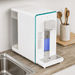 Countertop hydrogen water purifier on a work surface with wooden spoons in a holder