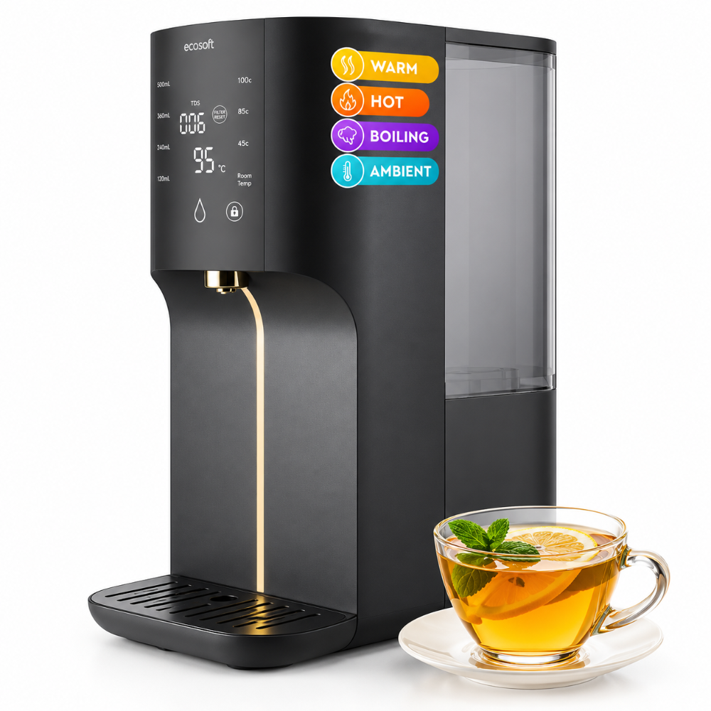 A black ecosoft countertop water dispenser with a digital display and gold accents, shown next to a glass of iced tea on a white background.