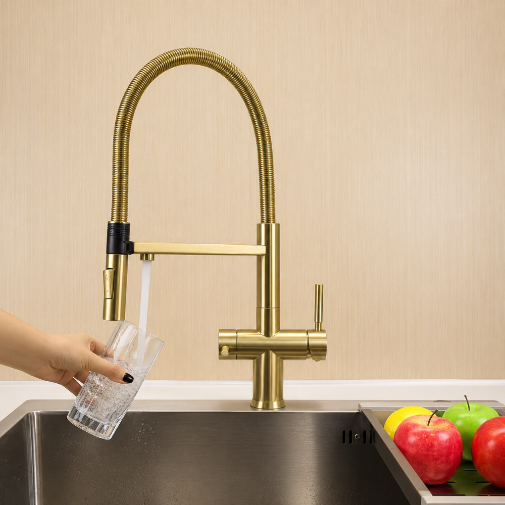 Brushed brass hommix kitchen faucet with a sink and fruits on a countertop