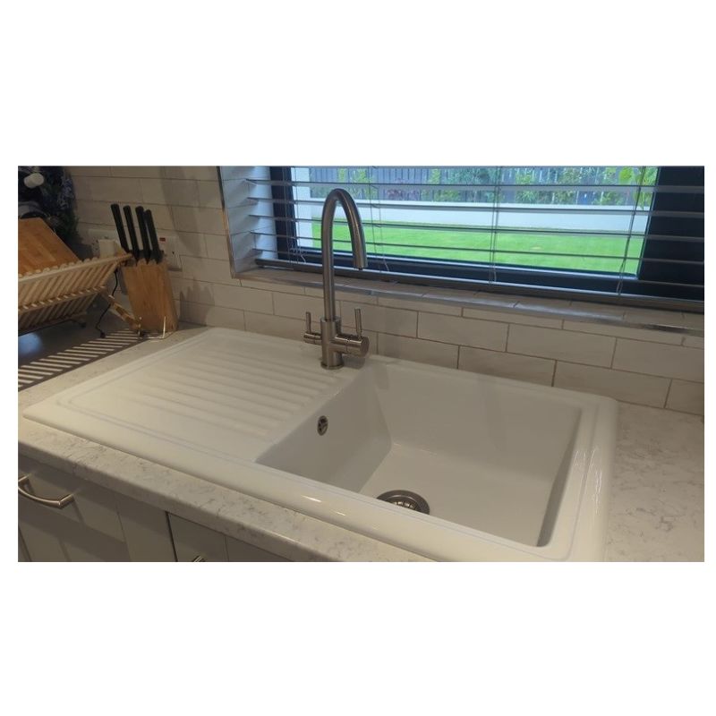 A three way triflow tap installed in a kitchen