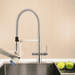 Modern kitchen faucet from Hommix with a beige wall background and an a apple and a lemon and apple