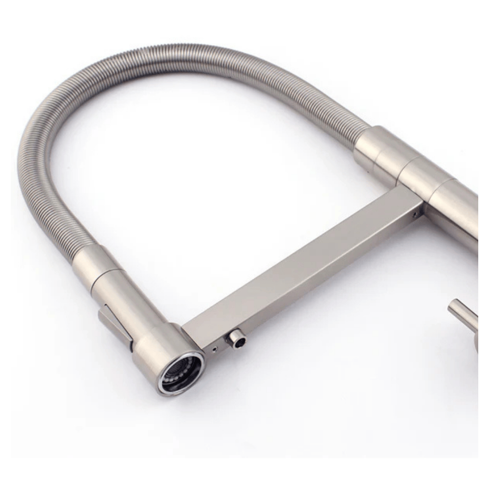 a close up of a kitchen faucet dispensing point in brushed nickel on a white background