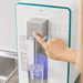 a countertop hydrogen water purifier pouring water into a glass