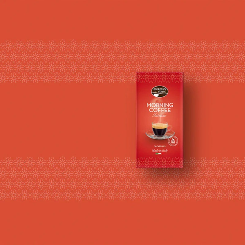Picture of espresso italia morning coffee against a red background