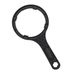 a black water filter spanner placed on a white background