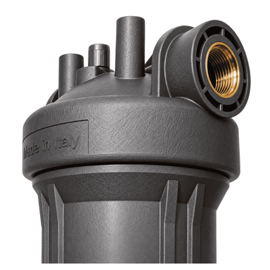 Close-up of a dark gray whole house water filter with a brass threaded connector on the side, featuring a textured finish and a 'Made in Italy' embossed label.