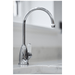 Hot water tap in Chrome on a marble countertop with a blurred background