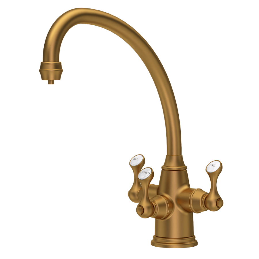 Aged brass three-lever kitchen tap with curved spout and white tip handles