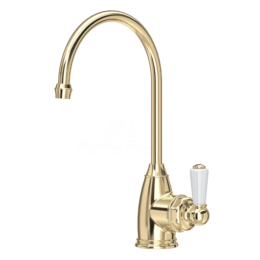 Gold kitchen faucet with white handle on a white background