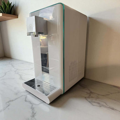 Ayus Wellness countertop RO water purifier with modern white finish on worktop