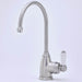 Brushed steel instant hot tap with white lever handle on light backdrop