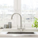 Verona 2 Lever brushed steel 3-way tap installed on modern kitchen sink beneath window